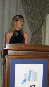 April Wayland speaking at banquet