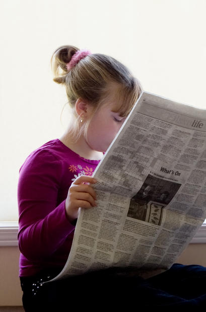 newspaper girl reading